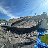 Roofing Crew at Work Ridge Roofing LLC crew performing a professional roof replacement with attention to detail and safety. From tear-off to final shin