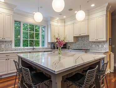 A Custom Island w/ Maple Cabinetry ?AMAZING? Features: A Custom Island with Maple Cabinetry painted Gauntlet Gray, plus brushed nickel hardware and Bri