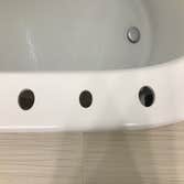 Bathtub Repair The homeowner chose to relocate plumbing fixtures - Original installation holes were properly supported and the repair area was refinish