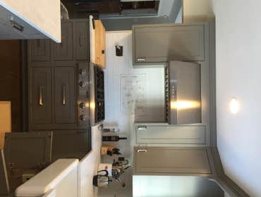 Kitchen (Huntington) A newly updated kitchen with sleek stainless steel applicances. Maple cabinets painted gray with a crown modeling finish, above a