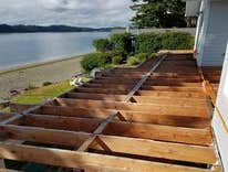 Photos by West Coast Remodelers LLC #3 All new double decker decking, top deck is surfaced with waterproof decking and lower deck is surfaced with 2x6 
