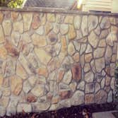 privacy wall restoration These pictures are of two privacy walls around outdoor patios that were in horrible disrepair. the stones were falling off the