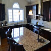 Kitchen - Travertine Travertine floors & backsplash
Granite counter tops & backsplash
Full overlay painted cabinets with raised panel
plus java on c