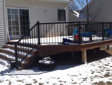 Photos by Custom Home Specialties Inc #2 Timber Tech maintenance free decks with powder coated railings.