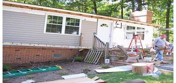 Siding This home was completely made over with an upgrade in siding and replacement vinyl windows.