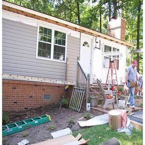 Siding This home was completely made over with an upgrade in siding and replacement vinyl windows.