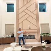 Photos by Mejia Drywall & Painting LLC #1 Wood design on the main entrance wall and on the fireplace of this beautiful house