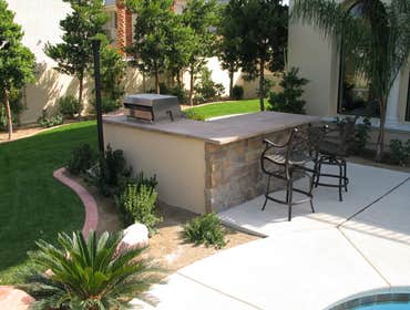 Tech-Noir Landscapes, Inc. Photos This display shows an array of fire pits, water features, and barbeques that add that special touch. Hard scape photo