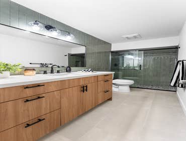 Bijeta | Bathroom This bathroom remodel focused on creating a clean, modern space with improved functionality and warmth. The project included a full s
