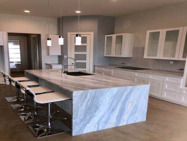 Kitchen after marble waterfall island installed