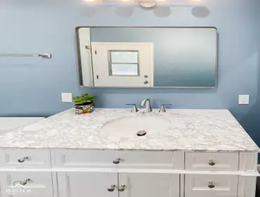 Thousand Oaks Bathroom Remodel We transformed this Thousand Oaks bathroom into your serene, modern retreat! Imagine a white vanity with silver handles 