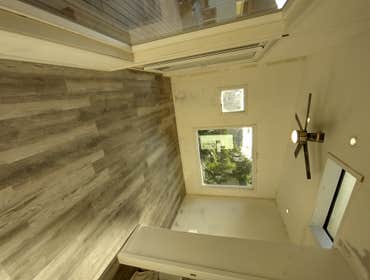 Photos by Stewart & Son Gate & Fence LLC #1 Tiny House with pergola. Small house 17' by 12' small bathroom with pocket door, and small sink with water 
