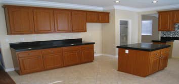 Monrovia kitchen cabinet reface This is a beautiful cabinet refacing job done in classic cherry color with with stylish arched upper doors (AL757) and 