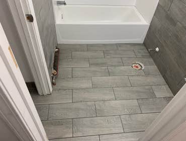 Photos by Bryan Contracting LLC #2 Install ceramic tile and change the bathtub