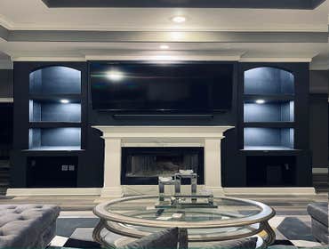 LIVING ROOM FEATURE WALL WITH CUSTOM FIREPLACE MANTLE