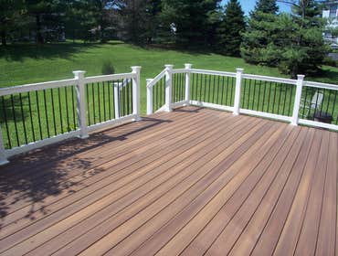 Photo(s) from American Deck Inc Fiberon Horizon Rosewood deck w/ White Vinyl rails & Black Balasters, Bel Air, MD