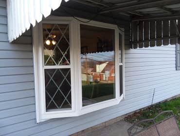 Photos by Professional Window Installers #1 Large bow and 8 windows. Fiberglass Andersen’s for this project