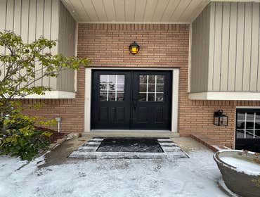 Photos by Excelsior Home Improvement #6 Remove existing entry doors and replace with custom doors- French style front door and garage entry door.