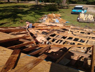 Photos by Service Restoration Pros LLC #1 A tree fell through the roof of this 3 bedroom house during Hurricane Ida. It left several gaping holes and a