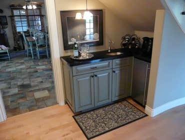 2007: Upscale Country Kitchen Cabinets A wet bar was created just off the kitchen under a staircase. The cabinets were made to match the kitchen island