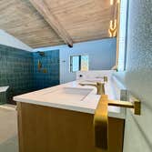 Photos by Ma Properties Construction #1 This bathroom remodel transformed an outdated space into a modern, functional retreat. The project included a c