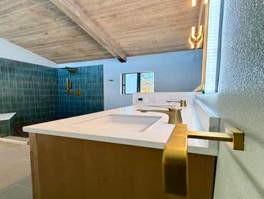 Photos by Ma Properties Construction #1 This bathroom remodel transformed an outdated space into a modern, functional retreat. The project included a c