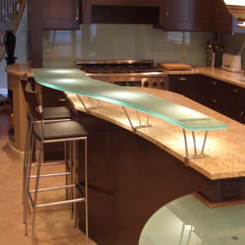 BCV Design kitchen project & other glass projects Round glass table on copper base, glass counter supported by stainless steel brackets and colored gla