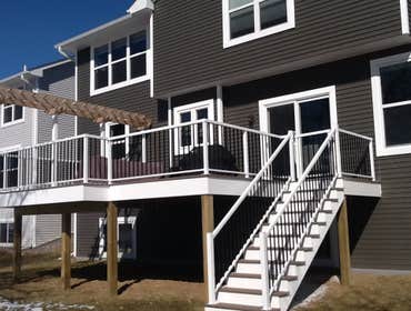 Photos by Custom Home Specialties Inc #2 Timber Tech maintenance free decks with powder coated railings.