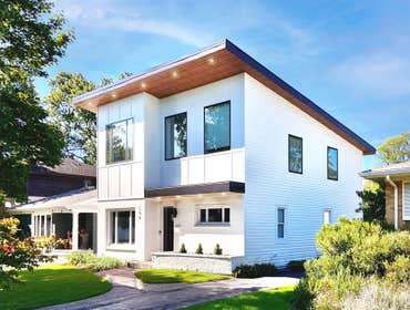 Custom Home Addition Meet Casa-Haus. A home addition and interior renovation with a single slope roof and really nice interior spaces. Large picture wi