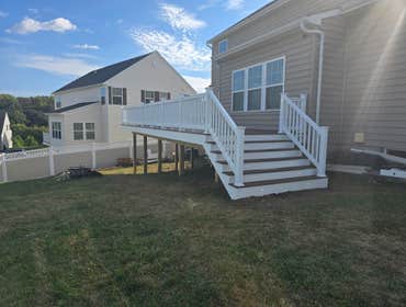 Photos by M&c Global Construction LLC #11 We built a 30×12 composite deck with integrated lighting for a Catonsville home, creating a durable, stylish,