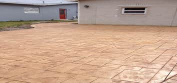 Front Driveway, Pembroke Pines Florida Full redesign of house front: removal of existing trees, new stamped concrete driveway with new lighting and spr