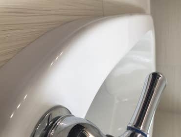 Bathtub Repair The homeowner chose to relocate plumbing fixtures - Original installation holes were properly supported and the repair area was refinish