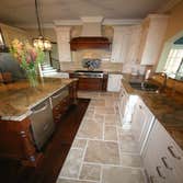 Scandone House This is a new construction home tile and marble installation custom kitchen and bath work.Custom marble in main foyer, custom work throu