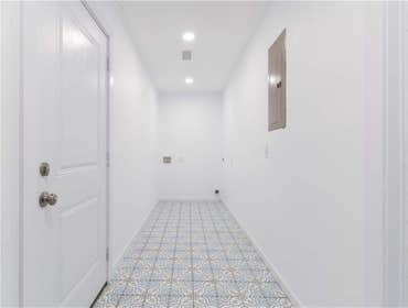 Photos by Rojas Acquisitions LLC #4 Redesigned house's footprint, added square footage to the overall living space, opened up kitchen/living area to ac