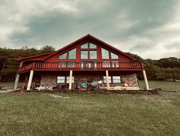 Photos by Happy Hammers Construction #2 Original beams were rotten and replaced with pressure treated 6x6's. Deck was raised and leveled.