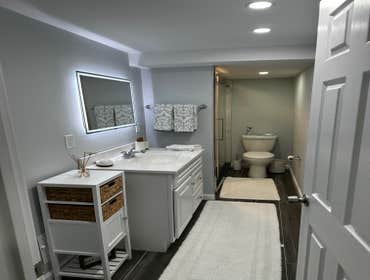 Photos by Eagle Construction & Remodeling Corp #1 Finish basement with a bathroom