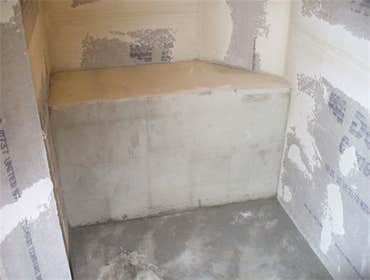 Concrete block seats built in waterproofing