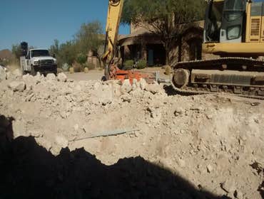 The Haidary Residence Grading and Rip Rap Placement for Project in Mesa.