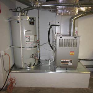 DunRite Heating & Air Inc. New Furnace Project Full base rebuild, new furnace, new a-coil, new water heater, new plenum, and a coat of white paint.