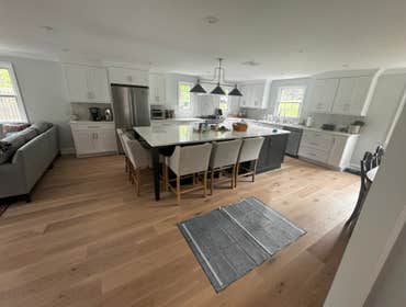 Spacious Kitchen Remodel with Heated Oak Floors Spacious Kitchen Remodel with Heated Oak Floors
This stunning kitchen renovation features a bright, op