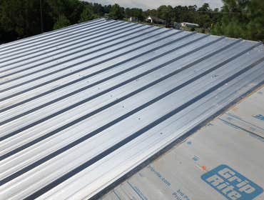 Photos by The Patchman Roofing Company #2 Installation of a galvanized metal roof onto a detached garage being built as part of a new home.