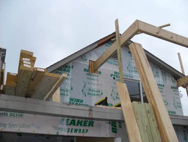 Custom Design Homes Project 1 Custom Design Homes added a screen porch overbuild. There was an open deck prior to this beautiful addition.