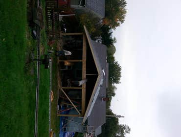 A covered patio we built. This is a covered patio we built. We also extended the overhangs and re shingled the roof. The pics are from start to finish