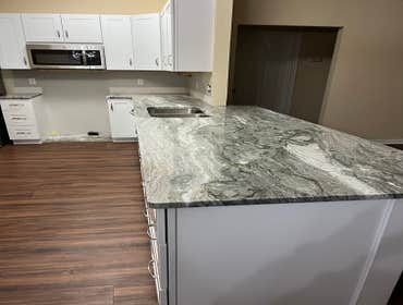 Photos by Tropical Building & Remodeling Inc #1 Completely removed old kitchen and end pony wall. Cut down pony wall to cabinet height and installed ro