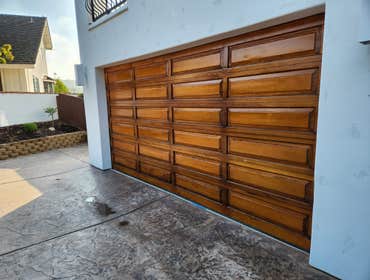 Refinishing Garage Doors & Entry Door by Rudy's Painting