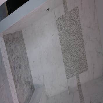 Bathroom Project Demolition, preparation and installation of shower pan, shower seat, shower walls, accent and bathroom floor.
