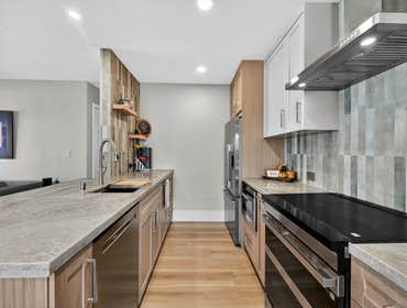 Creating an Open & Airy Dream Kitchen From the striking vertical tile backsplash to the seamless stone countertops, this San Diego kitchen remodel is p