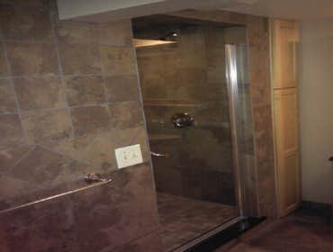 Basement Family Room Created a family room with a fireplace and bathroom in the basement of this home. Also replaced the old stairway with a new easier