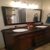 Bathroom vanity, mirror, fixtures, painting