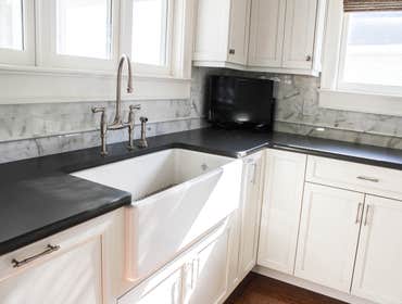 Baine Contracting Inc Project Multiple jobsites - showing kitchens, interior and exterior trim work, new homes, bathrooms, tile work, wood and iron ra